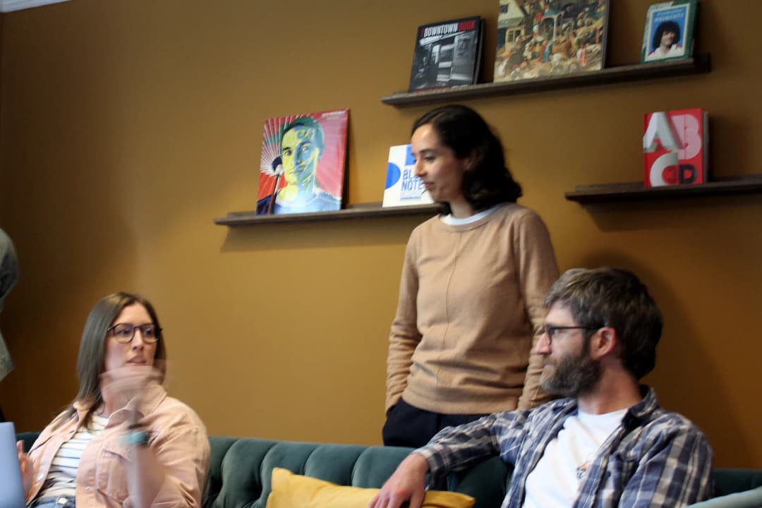 Project manager Katy, Digital Designer Kirti and Developer Mike sat in Bulb Studios lounge discussing upcoming project